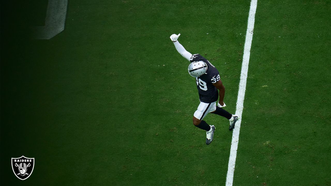 Las Vegas Raiders vs. Denver Broncos. NFL Game. American Football League  match. Silhouette of professional player celebrate touch down. Screen in  back Stock Photo - Alamy