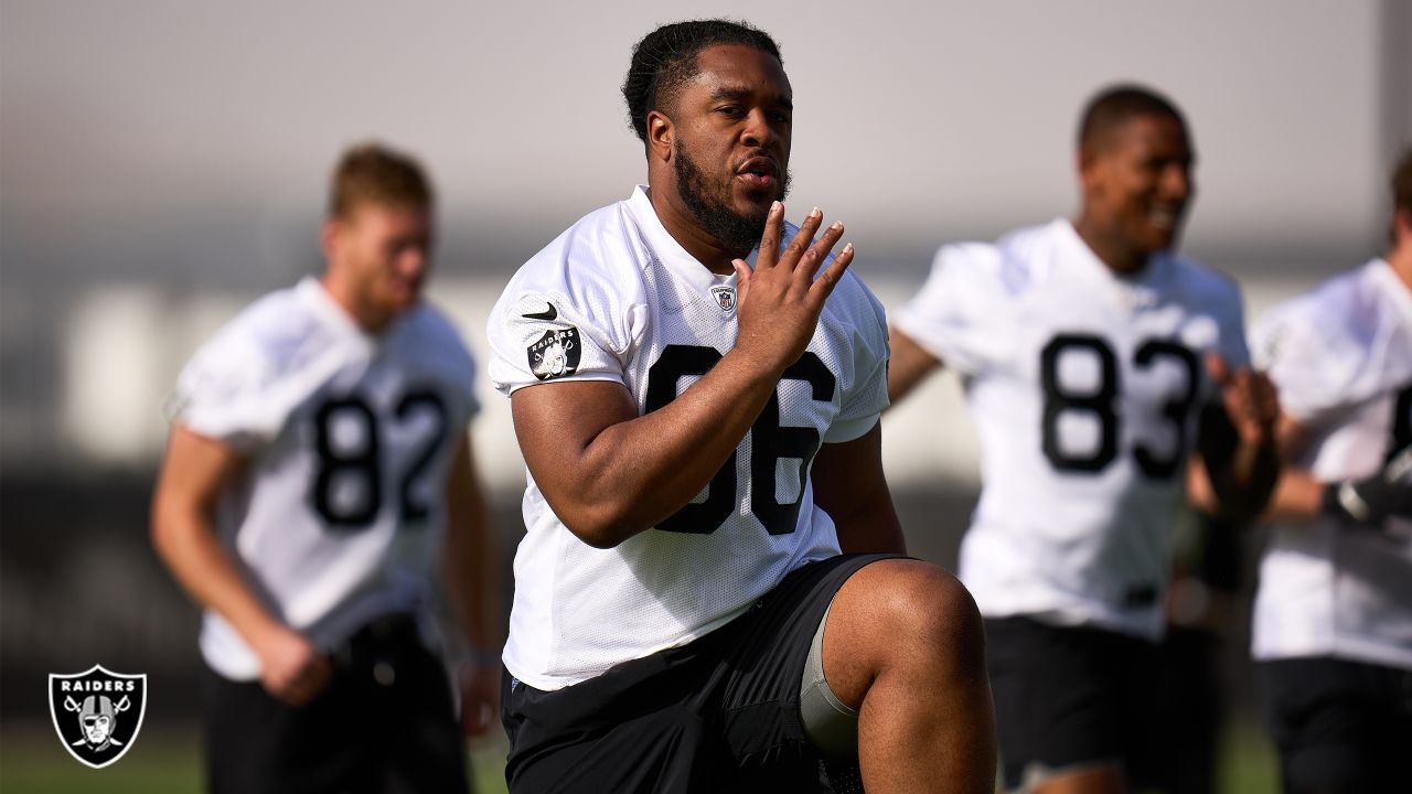 Las Vegas Raiders guard Dylan Parham (66) walks off the field after an  injury with head coach Josh McDaniels, left, during the first half of an NFL  preseason football game against the