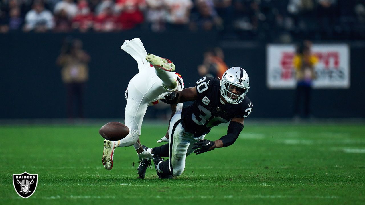 Safety Duron Harmon of the Las Vegas Raiders breaks up a pass to