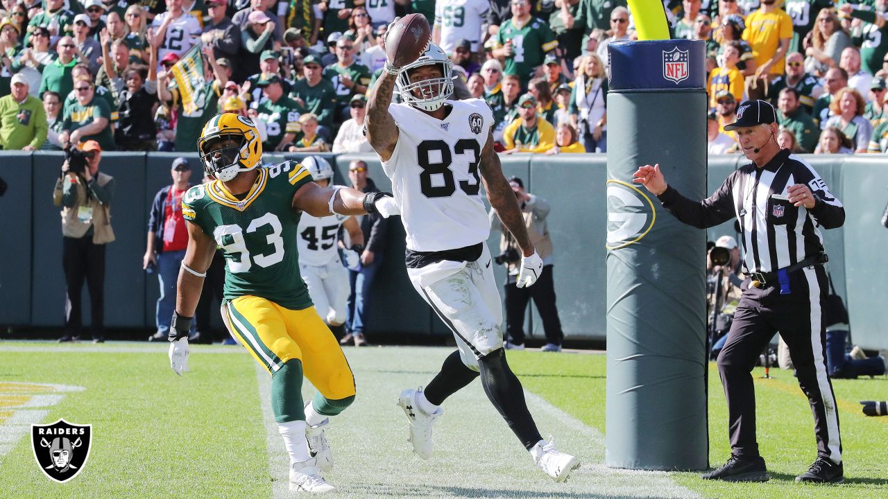 Raiders tight end Darren Waller (83) is tackled by Kansas City