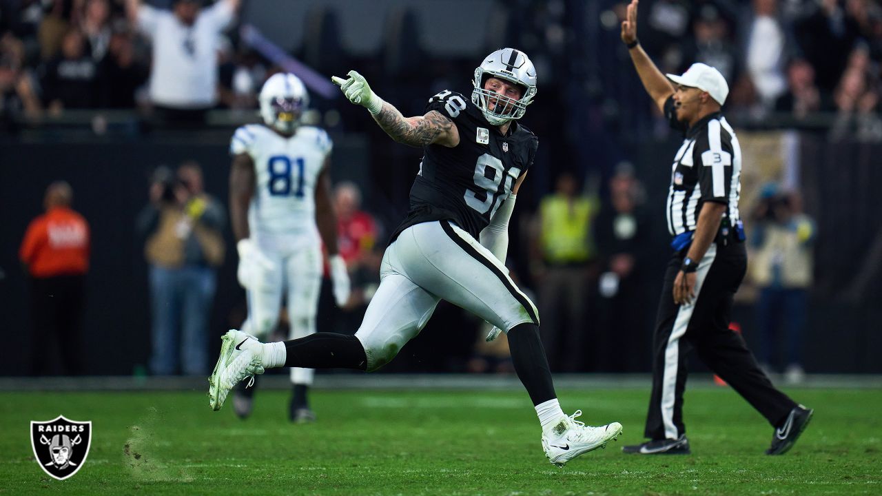 Oakland Raiders defensive end Maxx Crosby (98) gestures after being  penalized for roughing the …