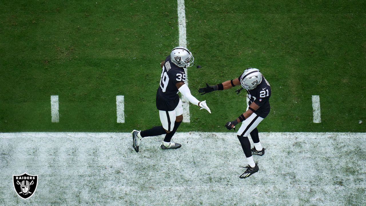 Denver Broncos vs. Las Vegas Raiders. NFL Game. American Football League  match. Silhouette of professional player celebrate touch down. Screen in  back Stock Photo - Alamy