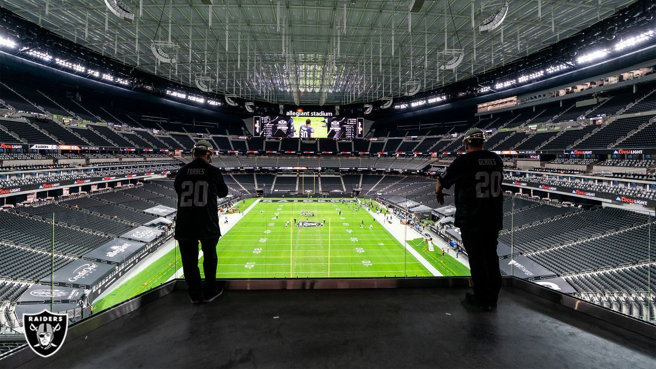 Allegiant Stadium construction workers light Al Davis Memorial Torch