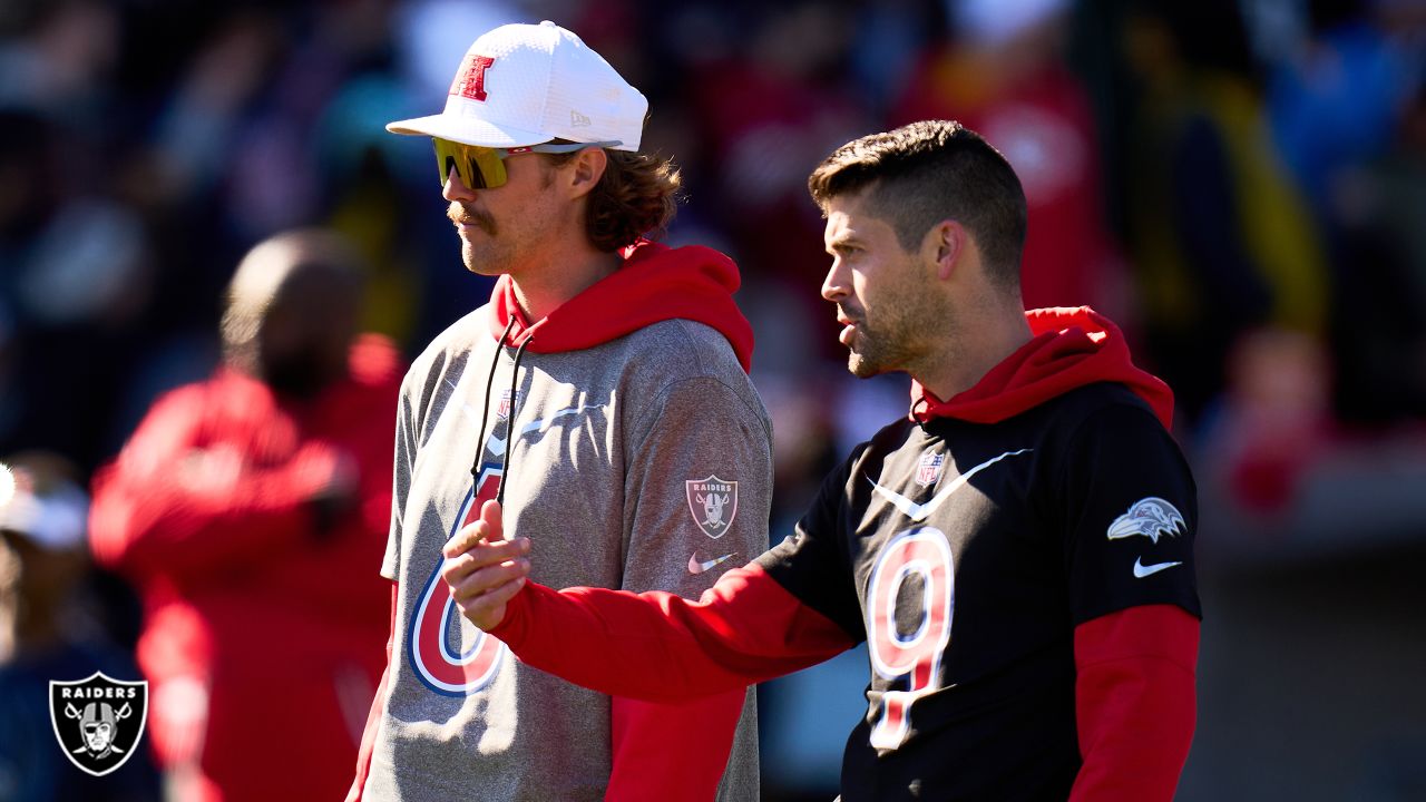 February 5, 2022: Las Vegas Raiders punter A.J. Cole (6) showing a family  member the technique to punting during the AFC Pro Bowl Practice at Las  Vegas Ballpark in Las Vegas, Nevada.