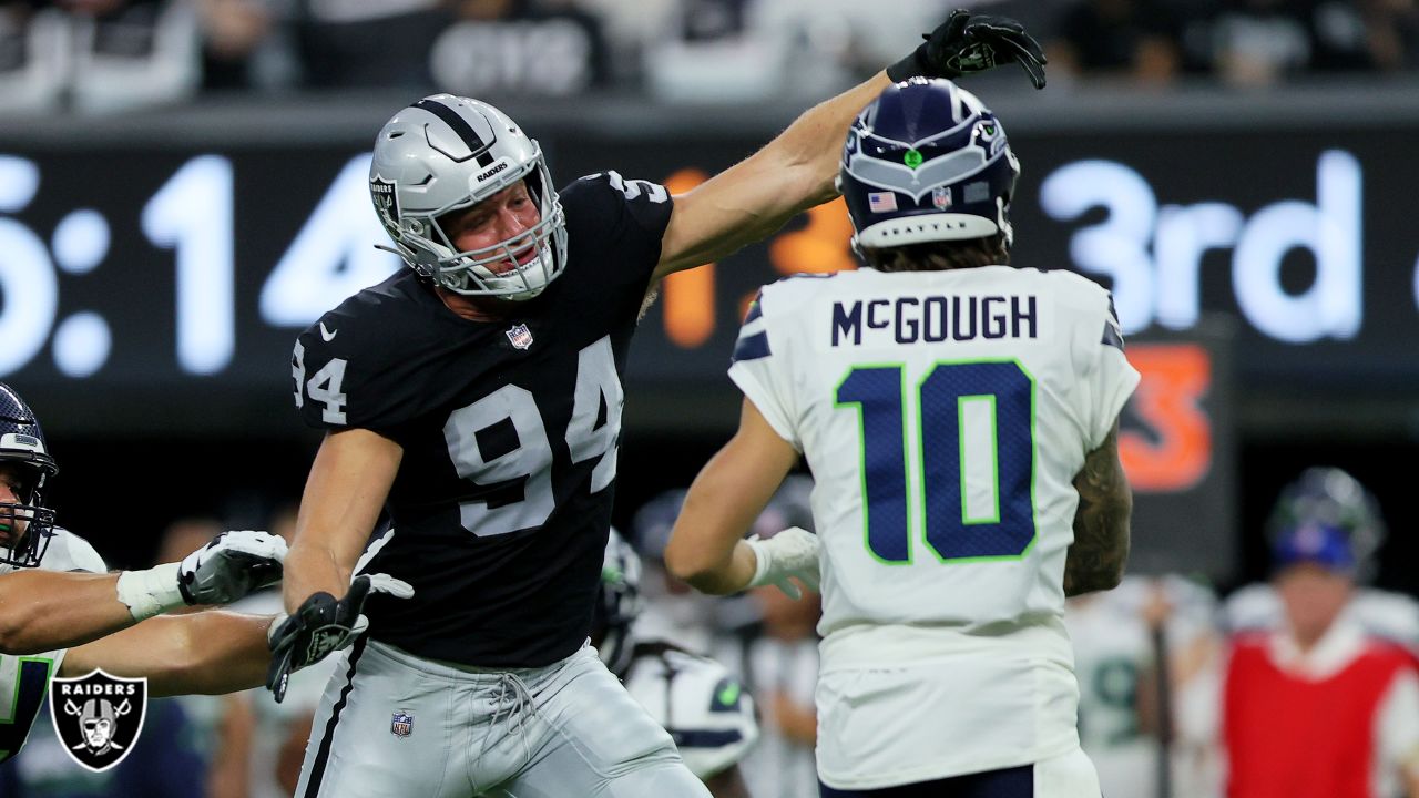 Las Vegas Raiders defensive end Carl Nassib (94) sits on the bench during  an NFL preseason football game against the Seattle Seahawks, Saturday, Aug.  14, 2021, in Las Vegas. (AP Photo/Rick Scuteri