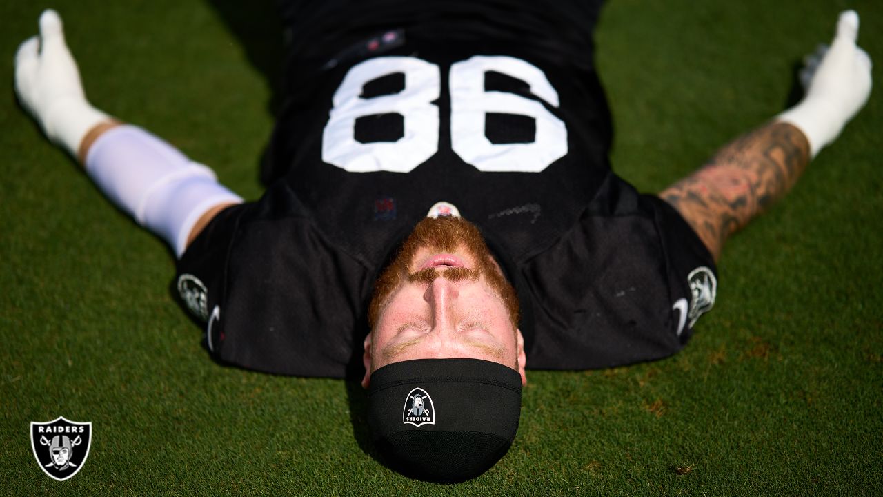 Oakland Raiders defensive end Maxx Crosby (98) gestures after being  penalized for roughing the …