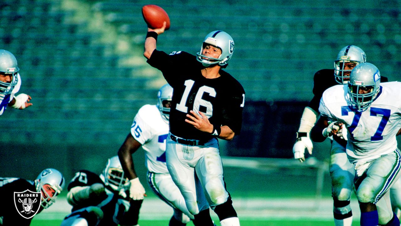 Oakland Raiders quarterback Jim Plunkett (16) prepares to throw the ball in  a game against the …