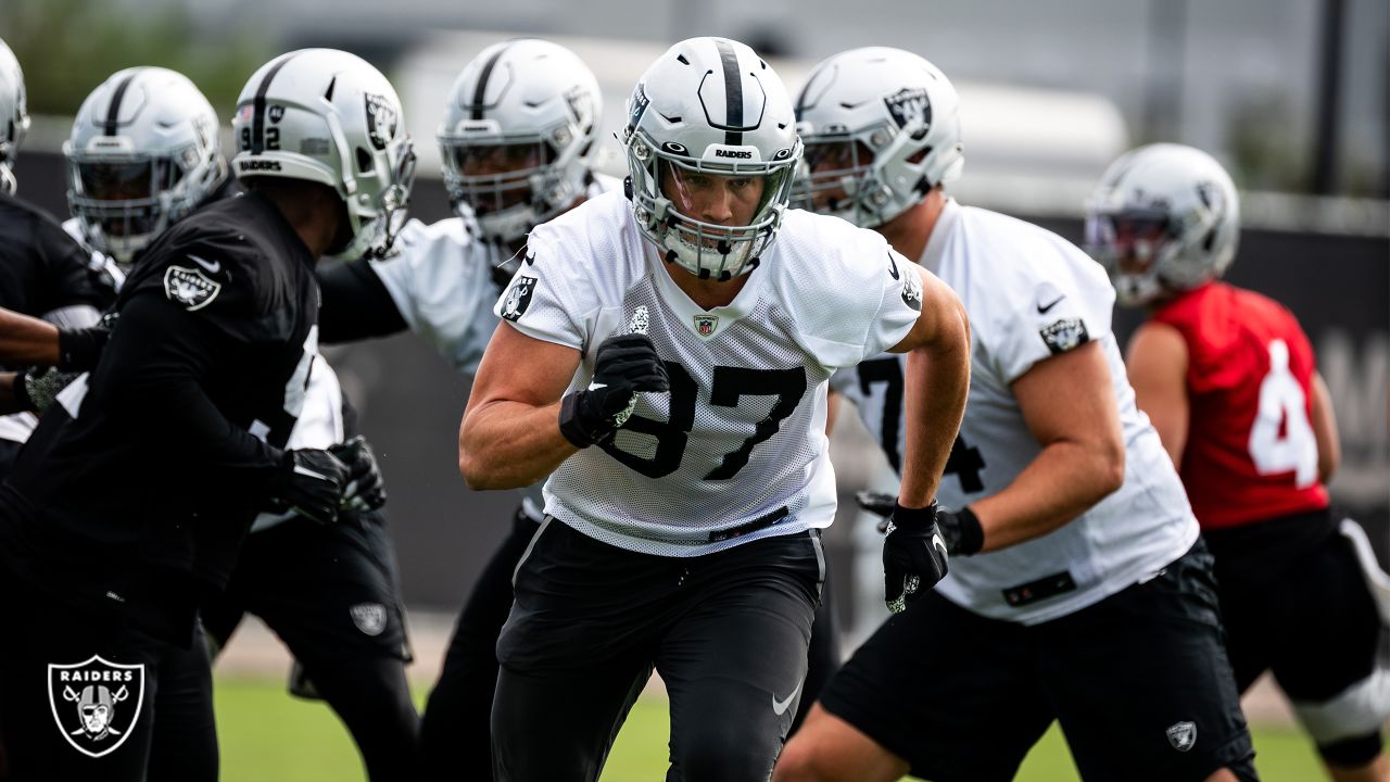 Raiders tight end Foster Moreau (87) is tackled by Raiders linebacker Javin  White (53) during a …