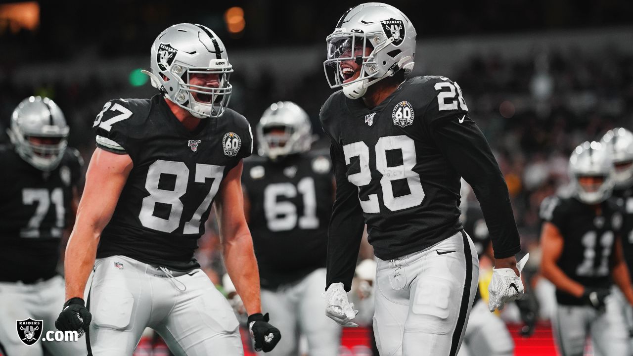 Oakland Raiders running back Josh Jacobs (28) celebrates after