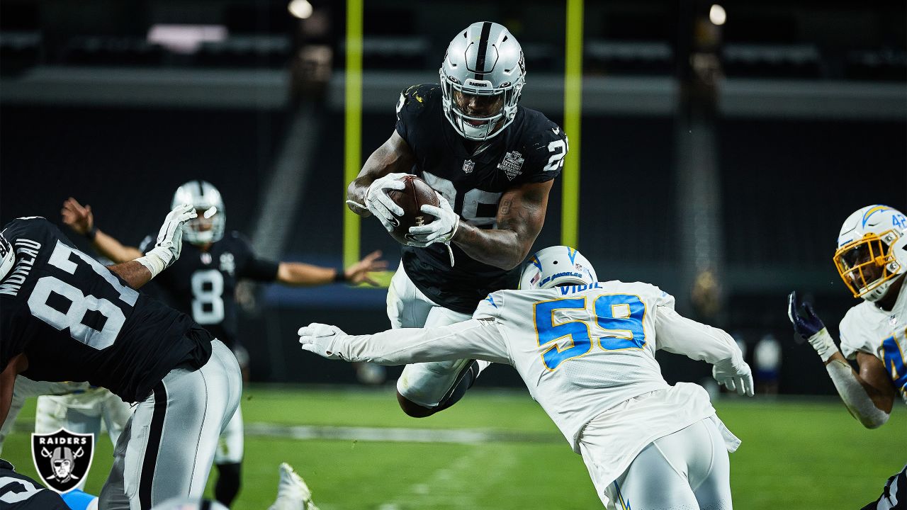 Las Vegas Raiders running back Josh Jacobs (28) runs the ball