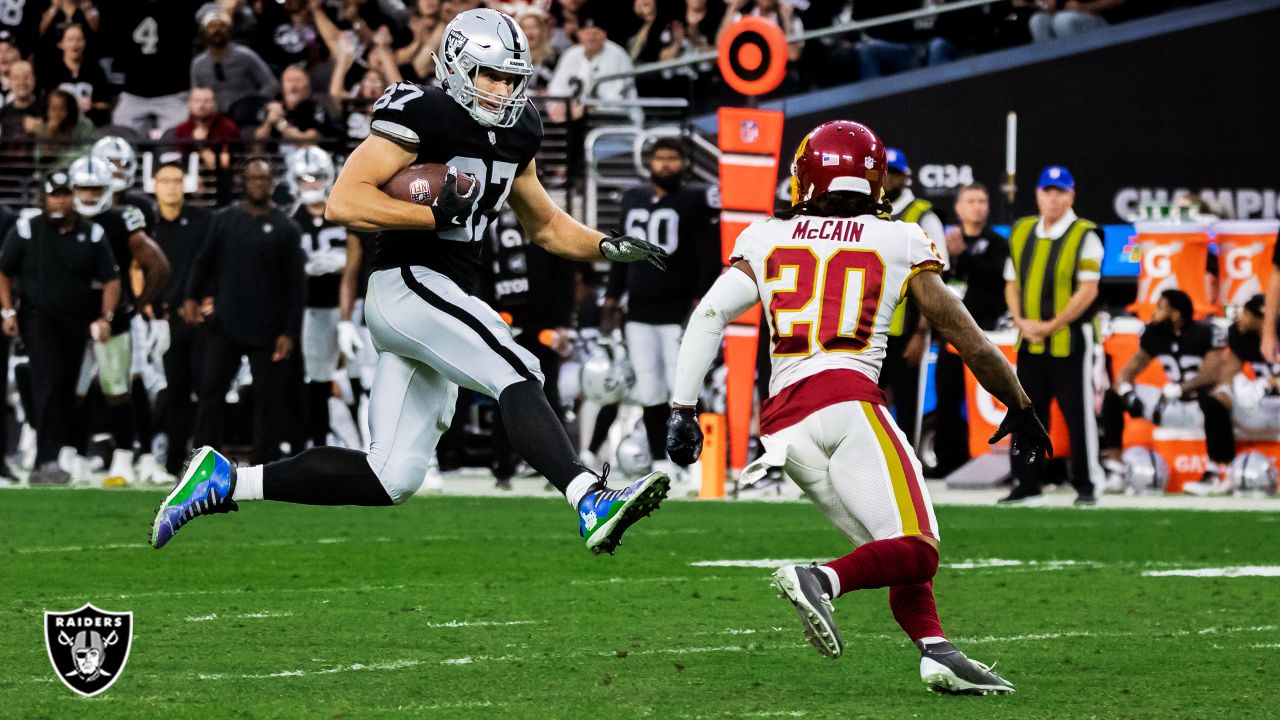 Las Vegas Raiders tight end Foster Moreau (87) is tackled by Miami