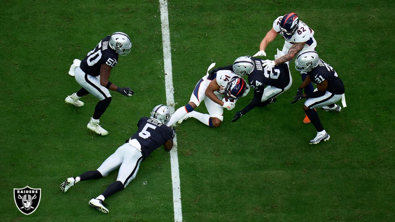 Las Vegas Raiders vs. Denver Broncos. NFL Game. American Football League  match. Silhouette of professional player celebrate touch down. Screen in  back Stock Photo - Alamy