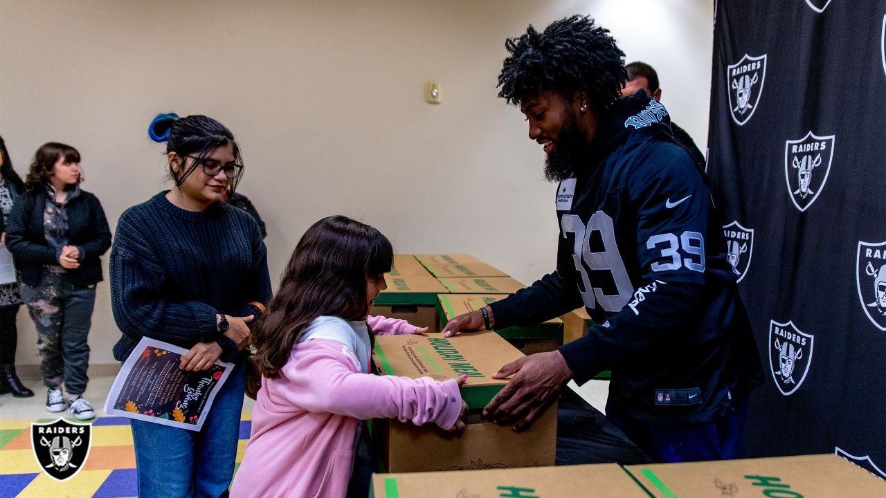 We didn't have a lot, but we did have family': Nate Hobbs, Tashawn Bower  spend quality time with North Las Vegas families during meal donation