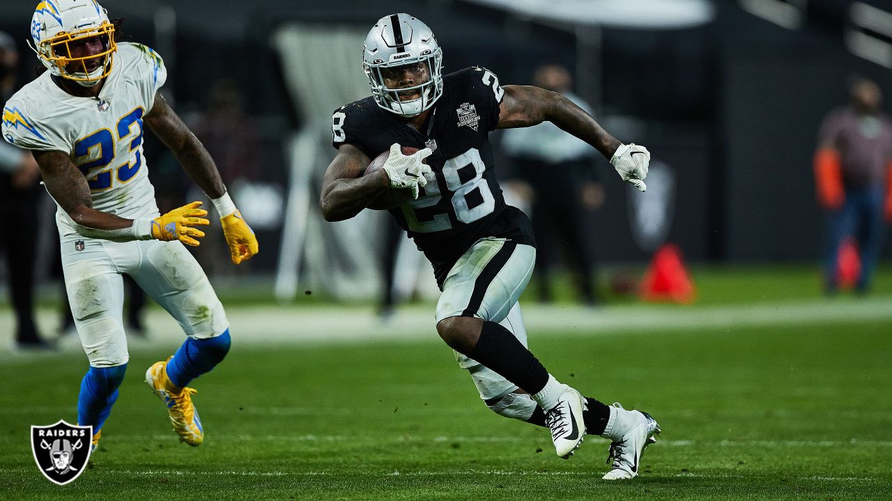 Running back Josh Jacobs of the Las Vegas Raiders wears Grinch