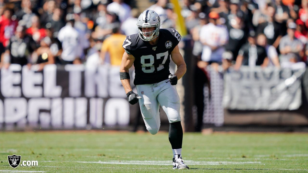 Raiders tight end Foster Moreau (87) gestures to a reporter during