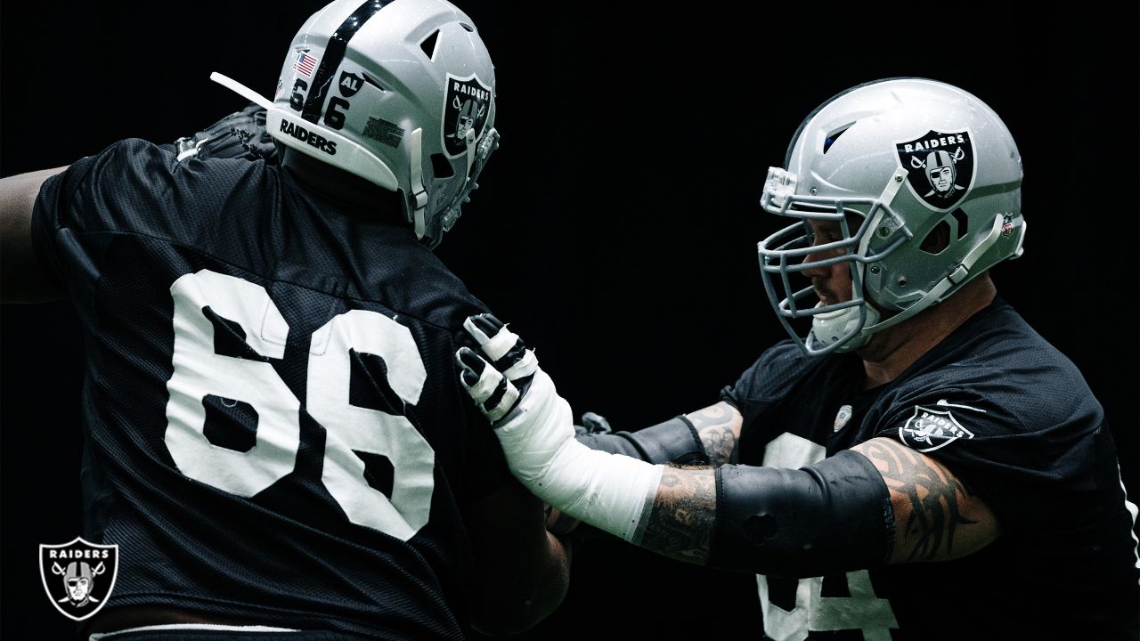 Rapper Ice Cube, right, hugs Las Vegas Raiders quarterback Derek Carr  during the first round of the NFL football draft Thursday, April 28, 2022,  in Las Vegas. (AP Photo/John Locher Stock Photo 