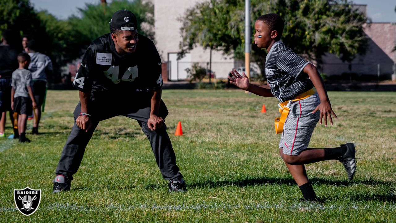 Raiders work with youth at flag football camp