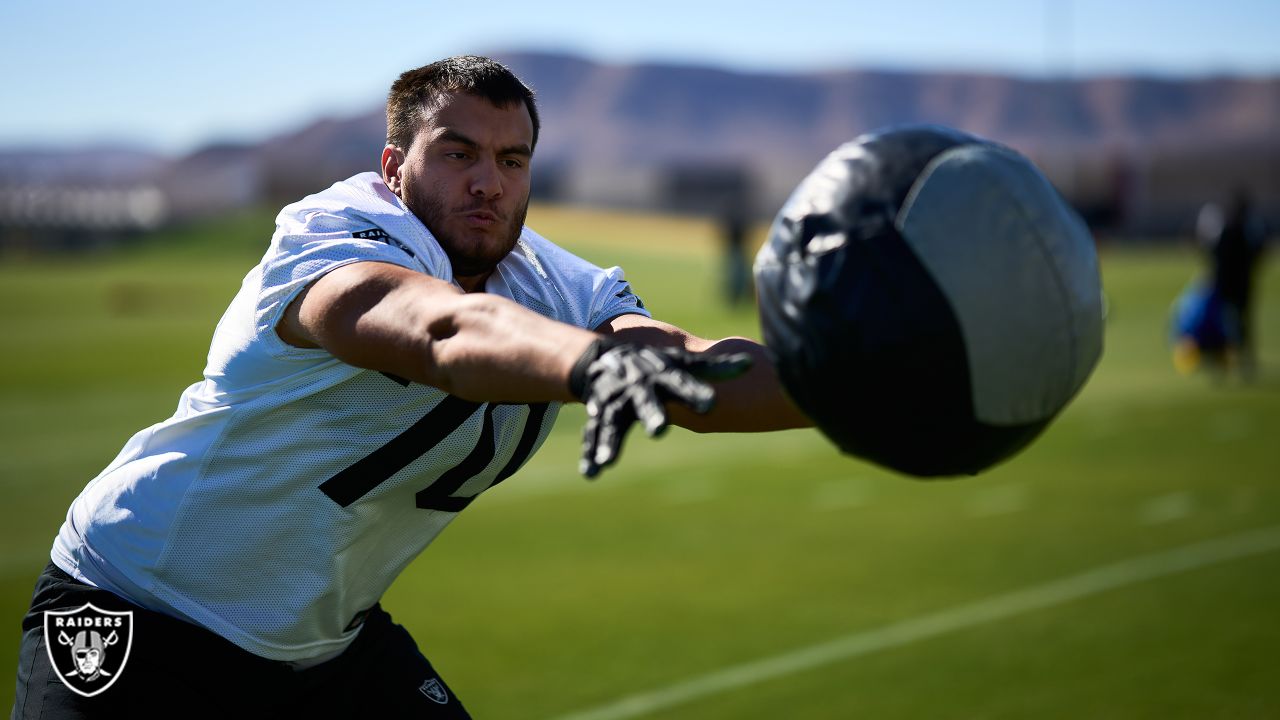 Denver Broncos tackle Sebastian Gutierrez takes part in drills