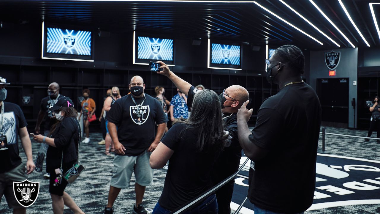 A man poses inside the Raider Image team store at Allegiant