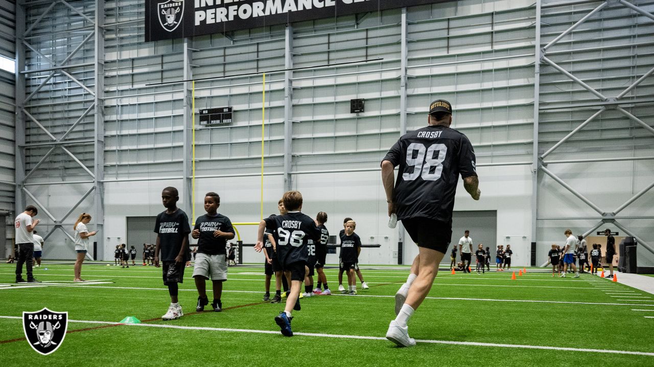 Las Vegas Raiders defensive end Maxx Crosby (98) salutes the crowd in the  first half during an …