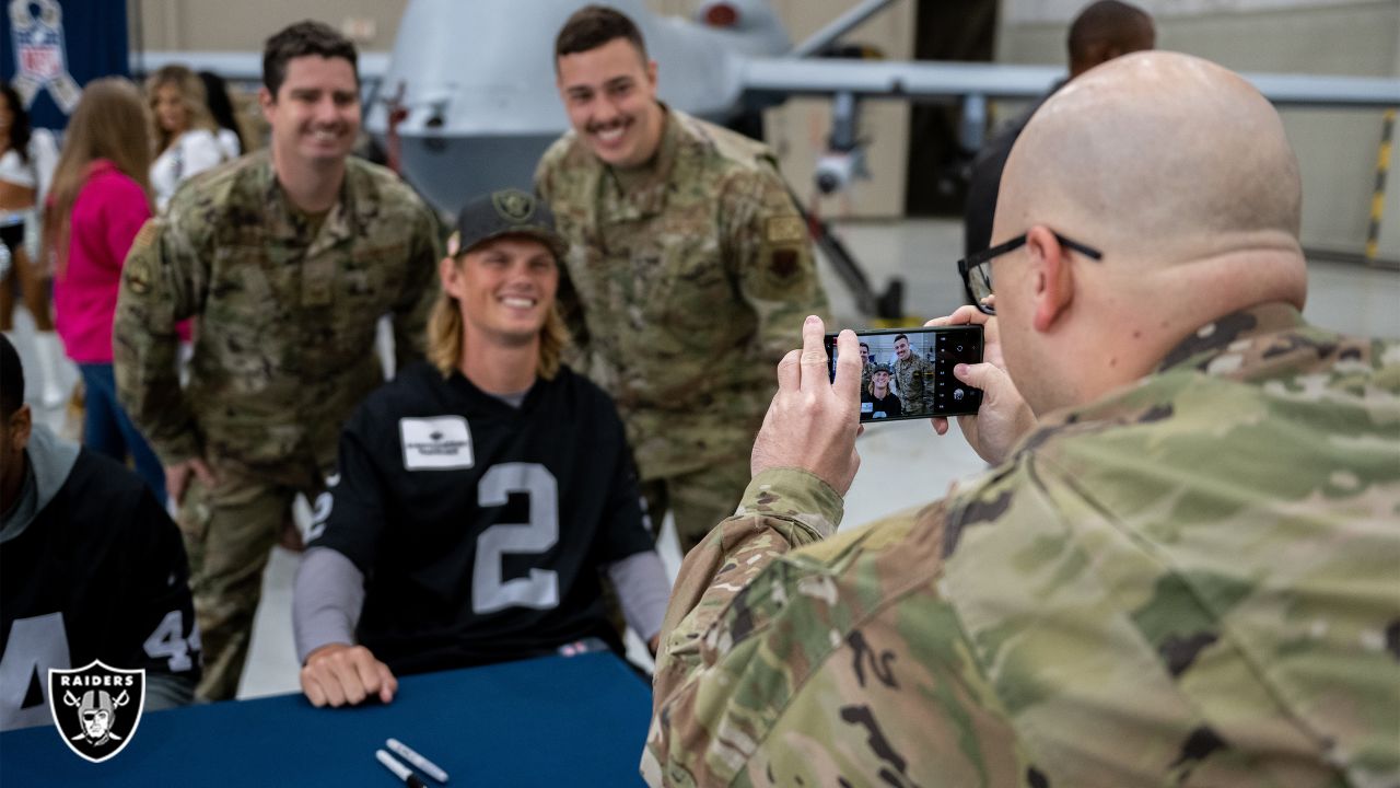 U.S. Military recruits are sworn in during halftime on Salute to Service  military appreciation day at an NFL football game between the Jacksonville  Jaguars and the Las Vegas Raiders, Sunday, Nov. 6