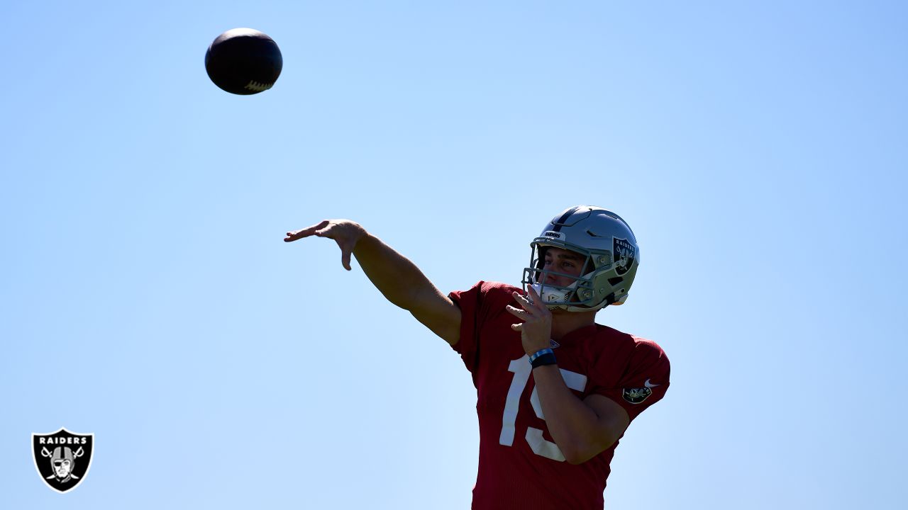 Las Vegas Raiders quarterback Chase Garbers (15) throws the ball on the  field before an NFL