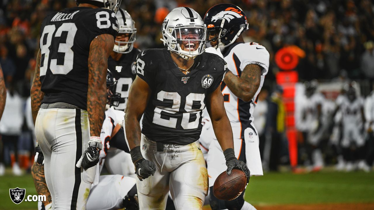 Oakland Raiders running back Josh Jacobs (28) celebrates after