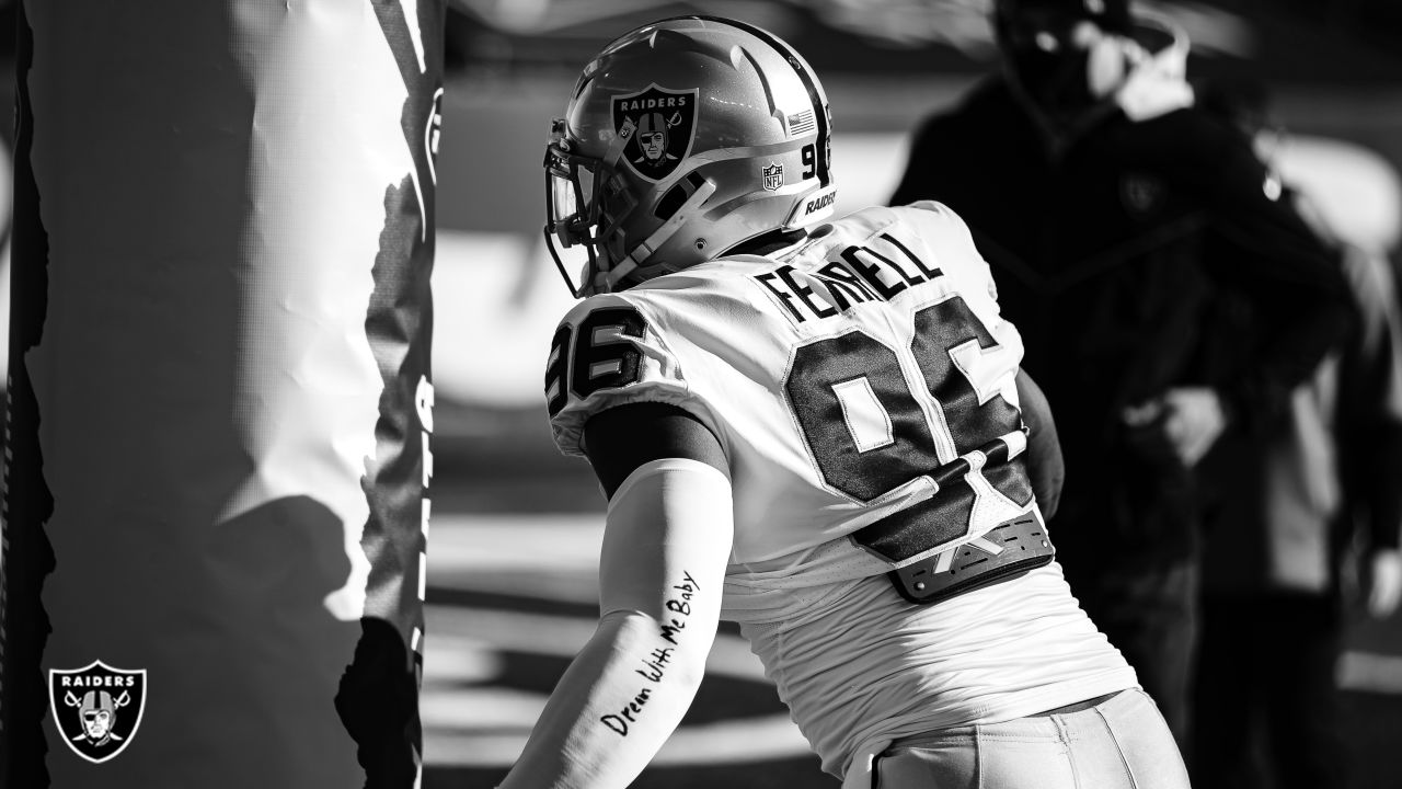 Raiders defensive end Clelin Ferrell (99) warms up on the field before an  NFL playoff game agai …