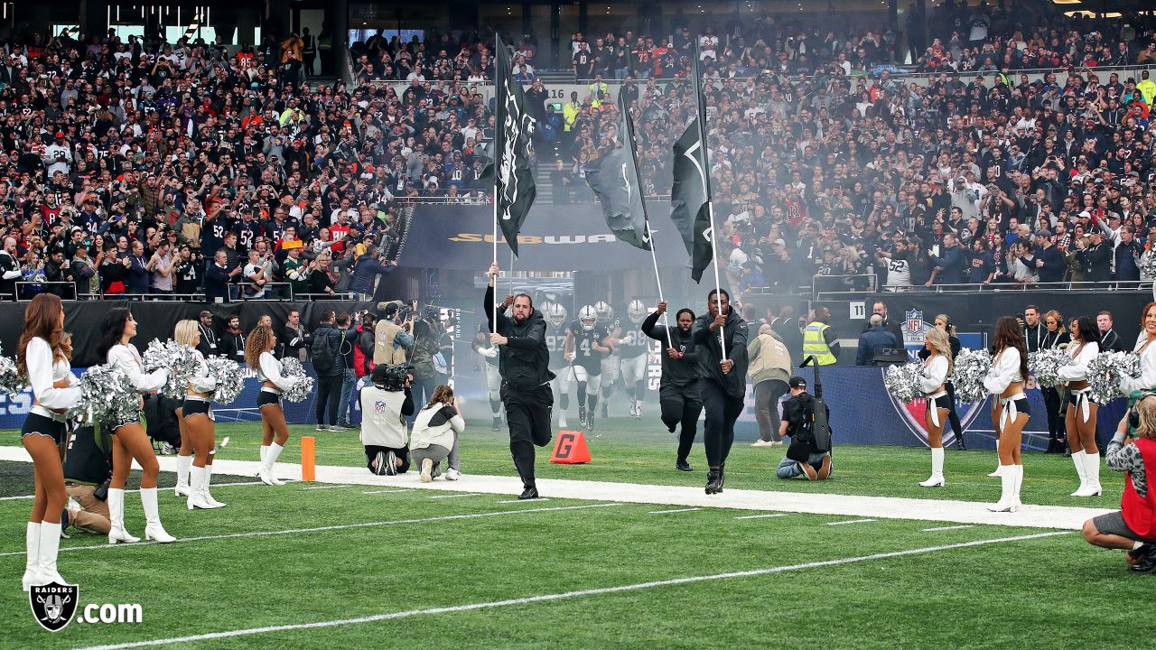 An Oakland Raiders cheerleader cheers during the second half of an NFL  football game against the Chicago Bears at Tottenham Hotspur Stadium,  Sunday, Oct. 6, 2019, in London. (AP Photo/Kirsty Wigglesworth Stock