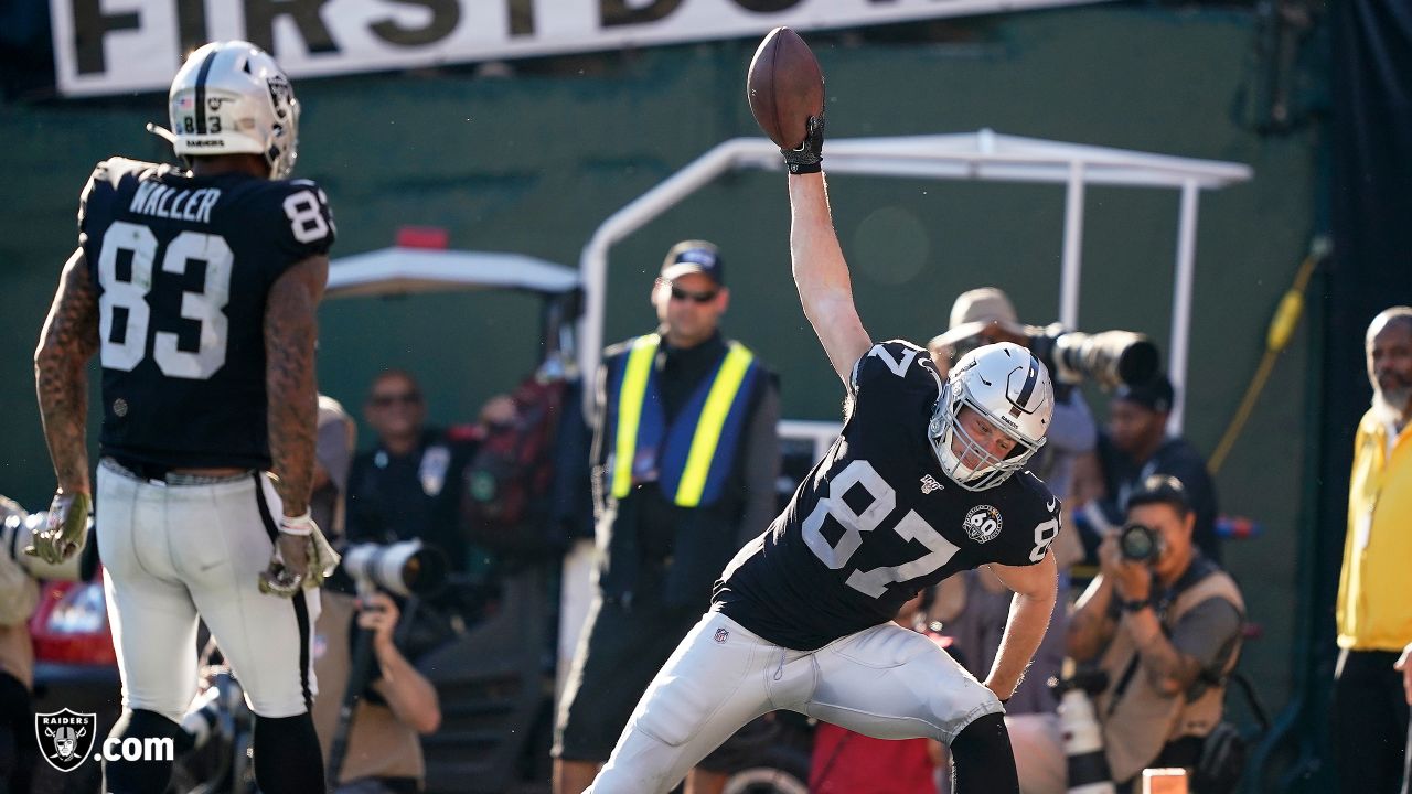 Raiders tight end Foster Moreau (87) gestures to a reporter during