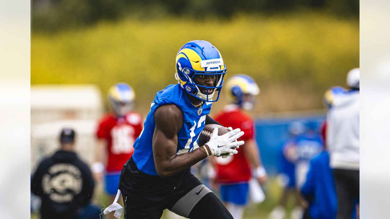 Los Angeles Rams quarterback Stetson Bennett (13) looks to throw a pass as  quarterback Matthew Stafford (9) watches him at the NFL football team's  training camp, Saturday, July 29, 2023, in Irvine