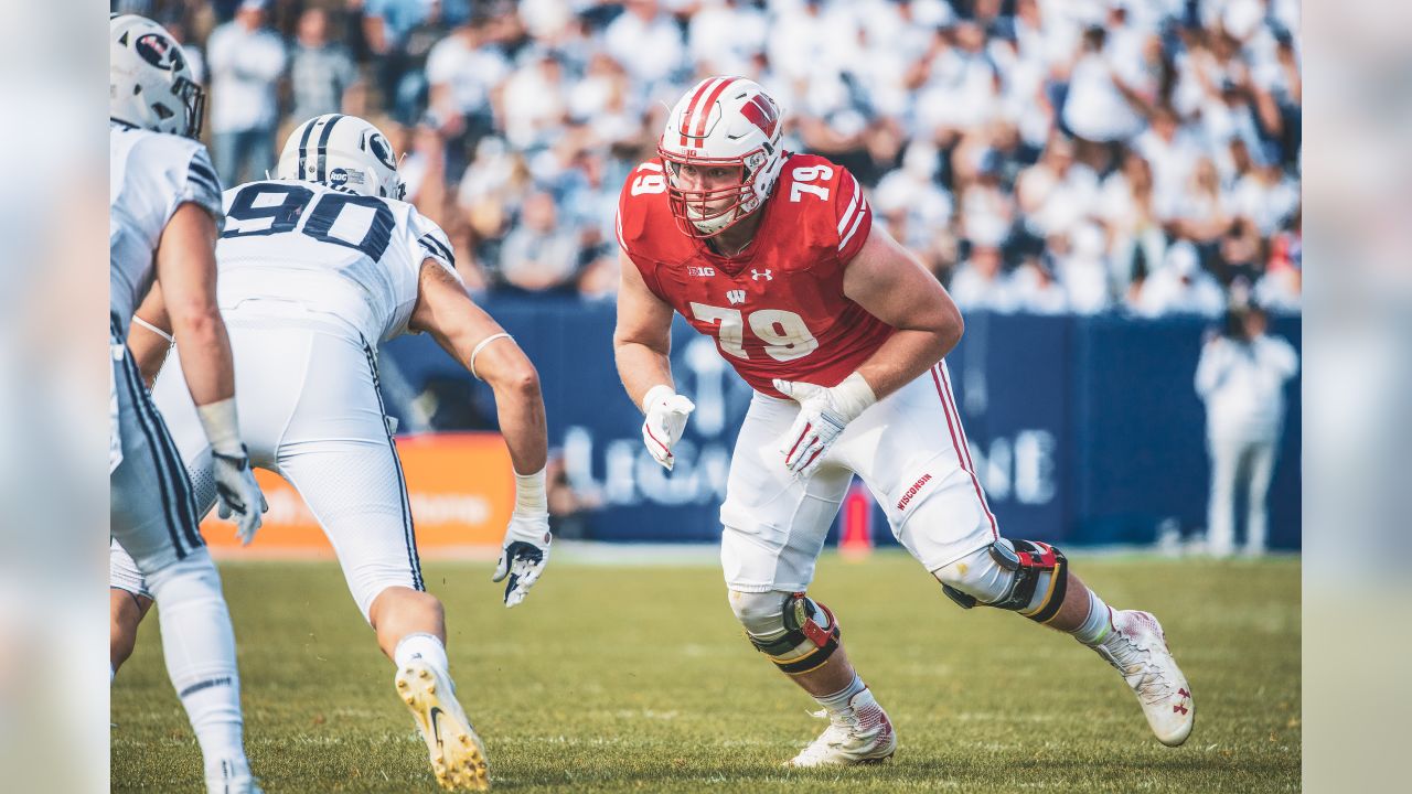 FILE - In this Sept. 22, 2018 file photo Wisconsin offensive lineman David  Edwards, center, blocks Iowa defensive end Chauncey Golston, left, from  quarterback Alex Hornibrook, right, during the first half of