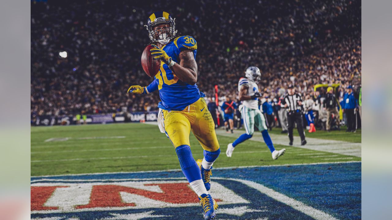 Los Angeles Rams running back Todd Gurley scores past Dallas Cowboys  cornerback Chidobe Awuzie during the first half in an NFL divisional  football playoff game Saturday, Jan. 12, 2019, in Los Ange …