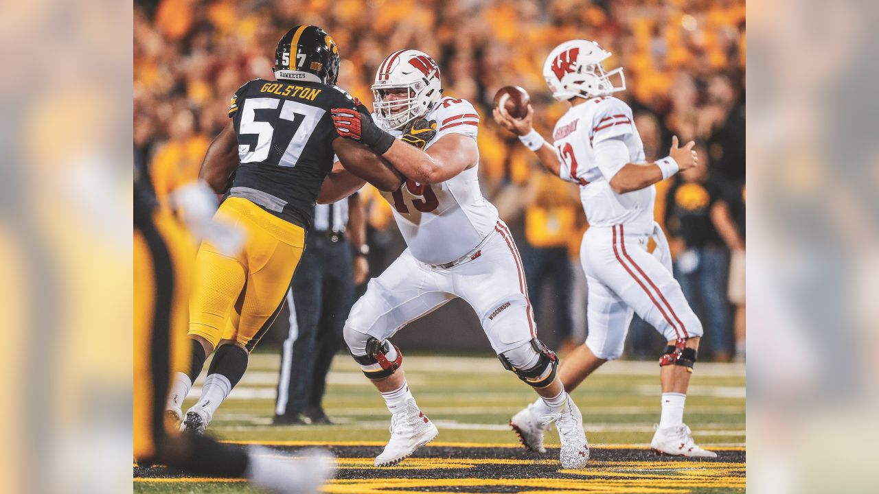 FILE - In this Sept. 22, 2018 file photo Wisconsin offensive lineman David  Edwards, center, blocks Iowa defensive end Chauncey Golston, left, from  quarterback Alex Hornibrook, right, during the first half of