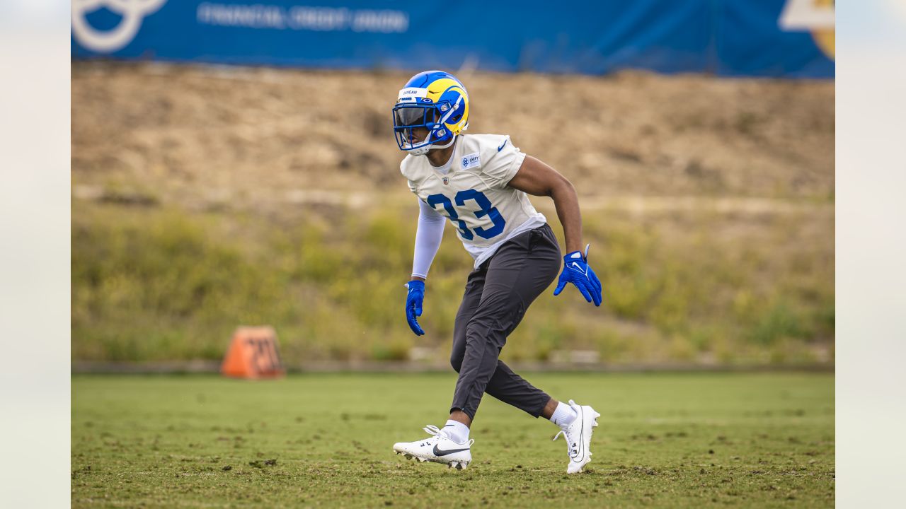 Los Angeles Rams quarterback Stetson Bennett (13) looks to throw a pass as  quarterback Matthew Stafford (9) watches him at the NFL football team's  training camp, Saturday, July 29, 2023, in Irvine