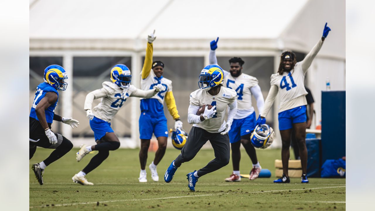 Los Angeles Rams quarterback Stetson Bennett (13) looks to throw a pass as  quarterback Matthew Stafford (9) watches him at the NFL football team's  training camp, Saturday, July 29, 2023, in Irvine