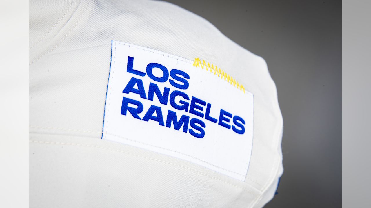 How I would improve the LA Rams uniforms. Keep the modern fonts and shapes.  Drop the gradients, the name tags, connect the horns, and ban the bone. I  propose a new alt