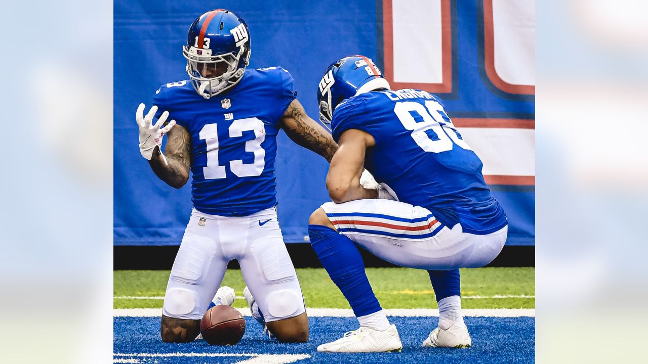 Odell Beckham Jr. catches passes from Eli Manning at Manning Camp 