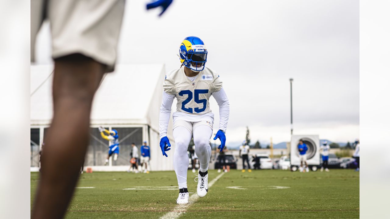 Los Angeles Rams quarterback Stetson Bennett (13) looks to throw a pass as  quarterback Matthew Stafford (9) watches him at the NFL football team's  training camp, Saturday, July 29, 2023, in Irvine