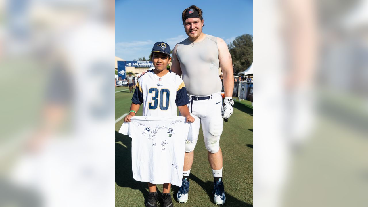 Los Angeles Rams guard Jeremiah Kolone (62) and center Coleman