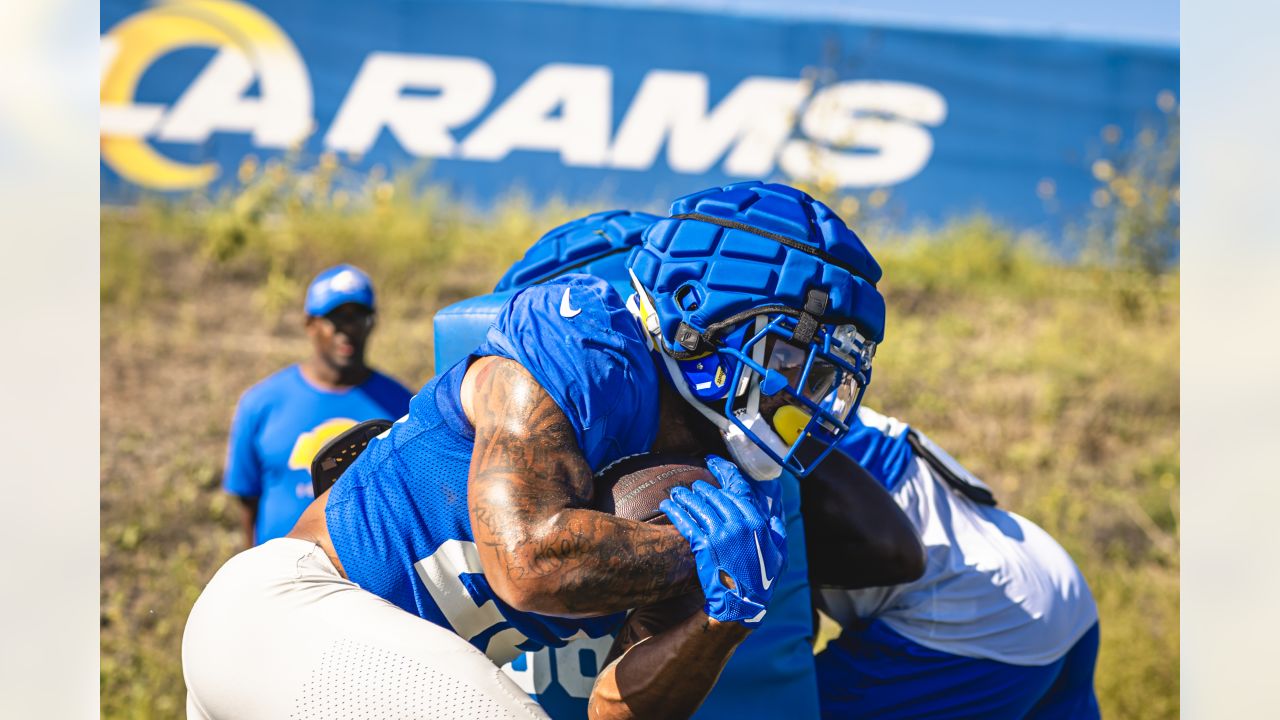 Rams practicing with yellow horns and blue facemasks on there