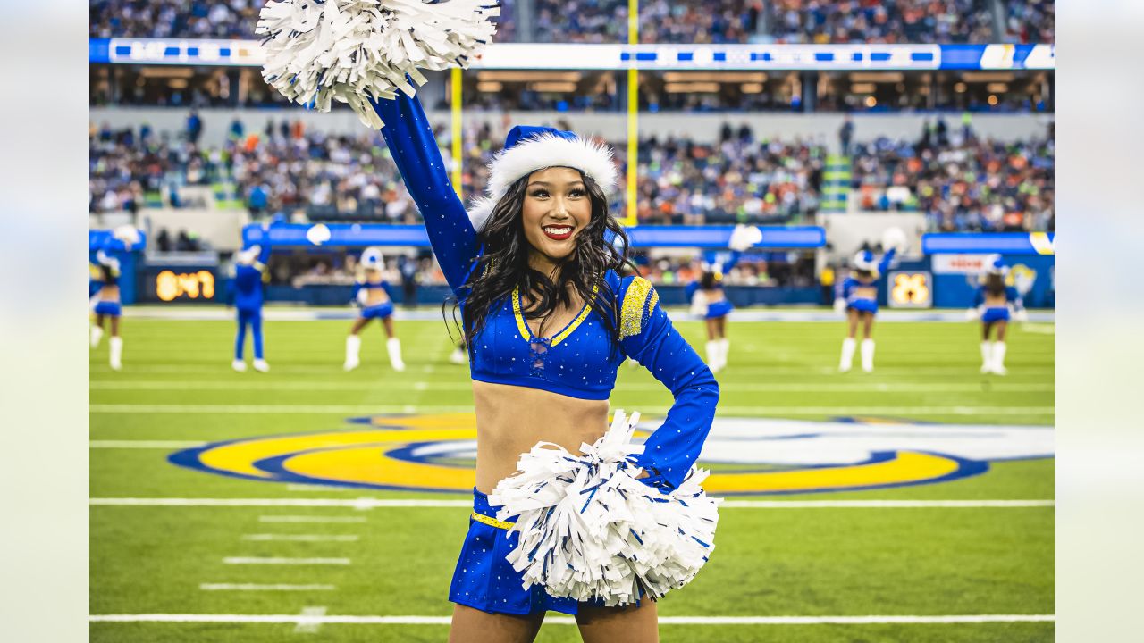 St. Louis Rams cheerleaders wearing camoulflage uniforms, entertain the  crowd during a game against the Denver