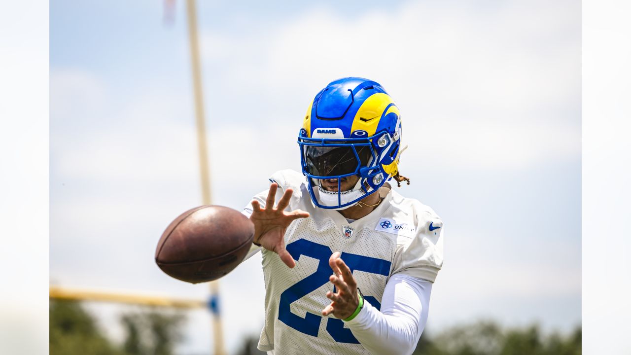 Los Angeles Rams safety Jason Taylor II, right, runs a play