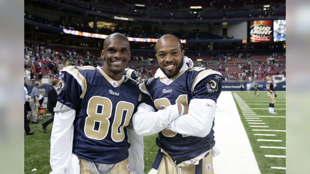 St. Louis Rams Marshall Faulk (L) congratulates Isaac Bruce after