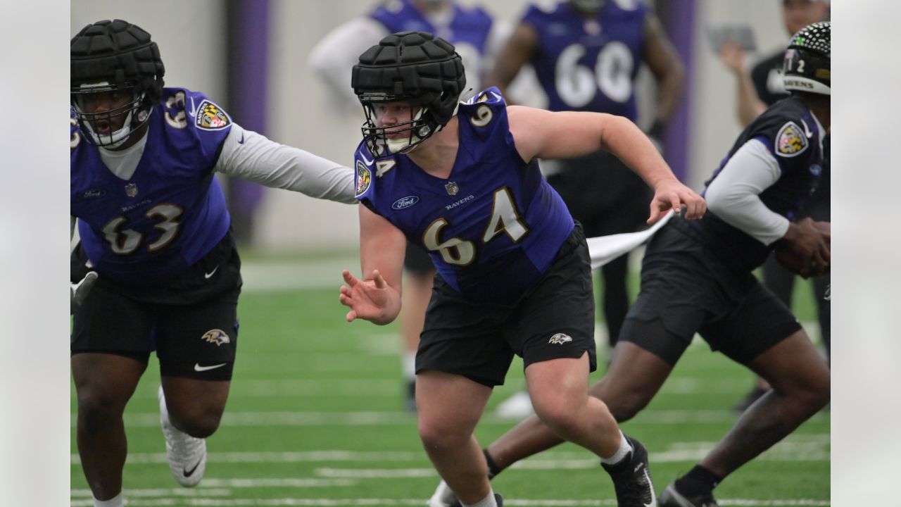 Baltimore Ravens center Tyler Linderbaum (64) looks on during pre