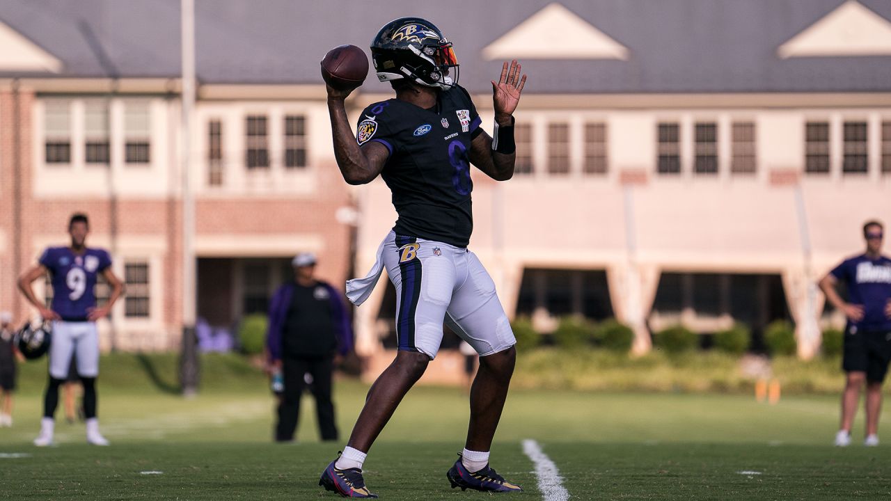 Ravens special teams consultant Sam Koch coaches up P Jordan Stout