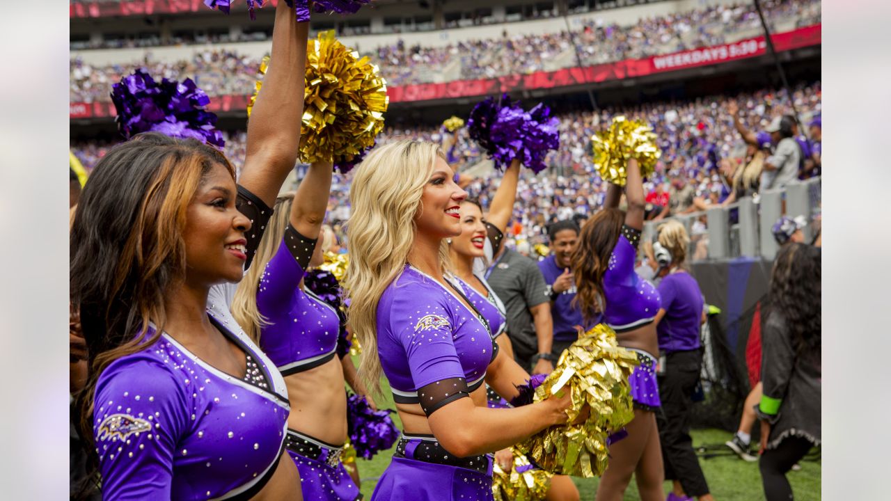 A Baltimore Ravens cheerleader battles the wind during a performance  against the Philadelphia Eagles during the first half of their NFL game at  M&T Bank Stadium in Baltimore, Maryland, December 18, 2016.