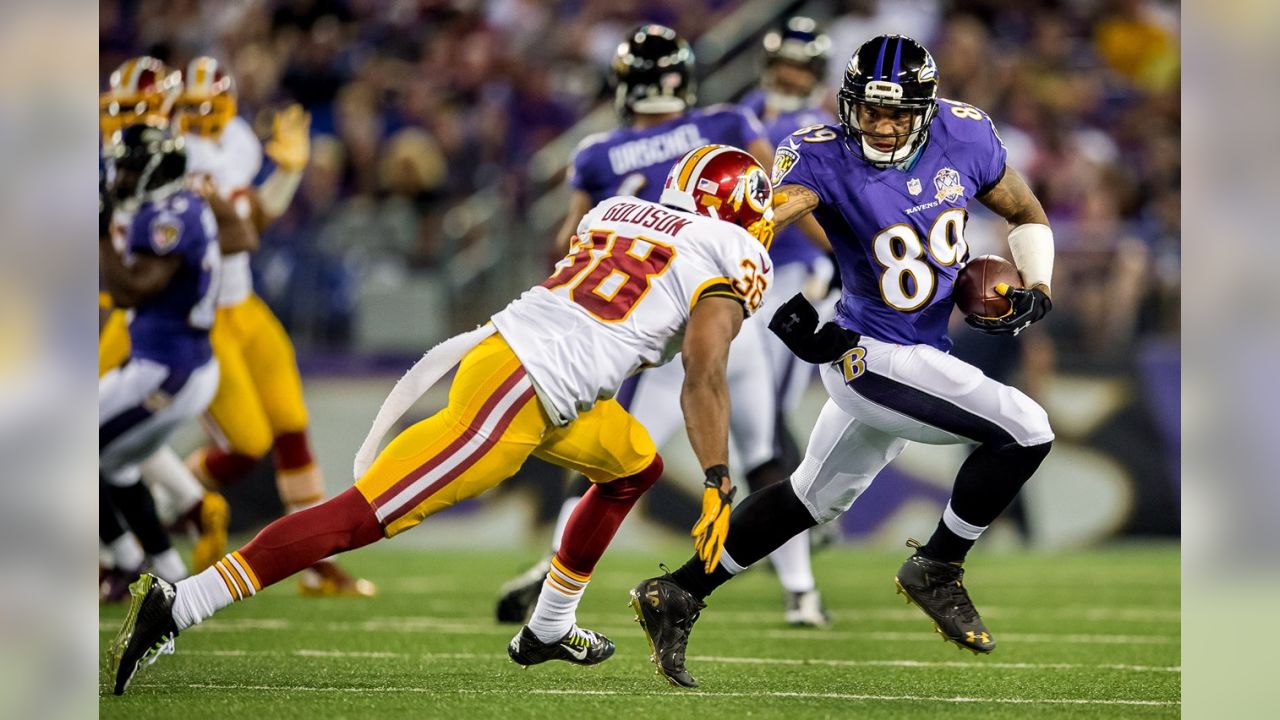 Baltimore Ravens wide receiver Kamar Aiken (11) celebrates with teammates  after scoring a 2-yard touchdown against the Cleveland Browns at M&T Bank  Stadium in Baltimore, Maryland on December 28, 2014. The Ravens