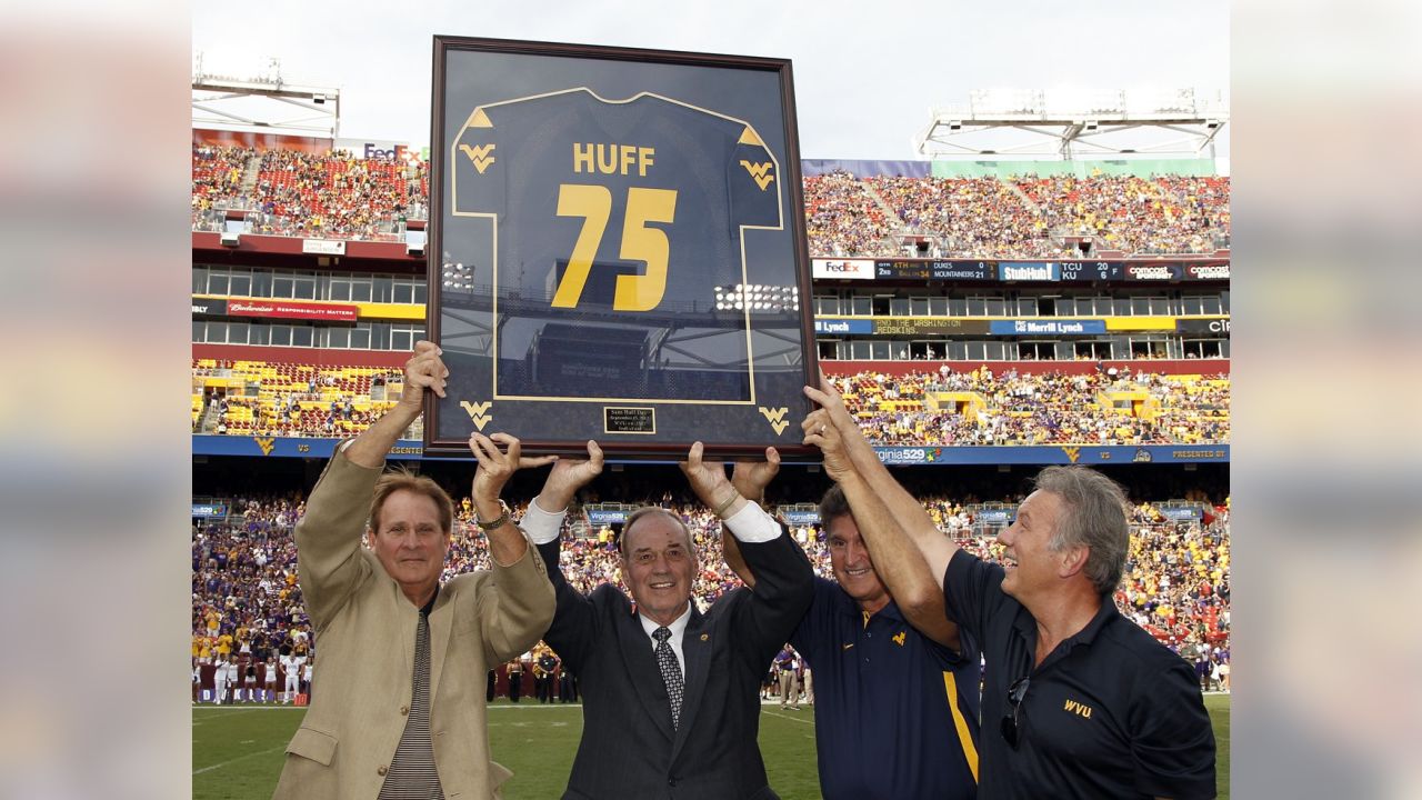 Washington Redskins defensive captain Sam Huff poses in front of