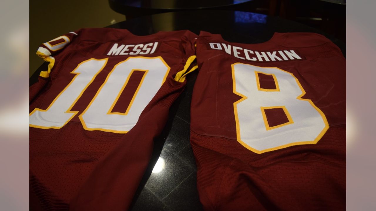 LOOK: Robert Griffin III presents Lionel Messi with Redskins